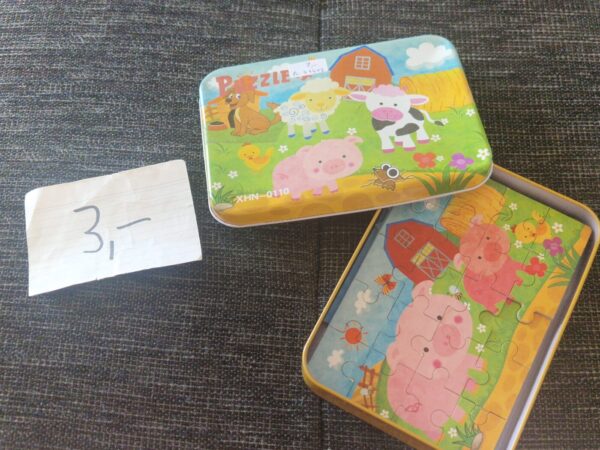 Mehrere Puzzle in Dose